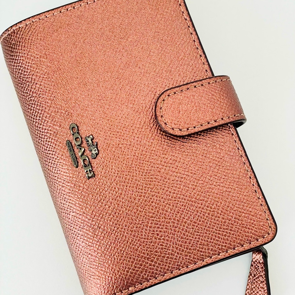 Coach Wallet with a snap and zipper, unique color.
